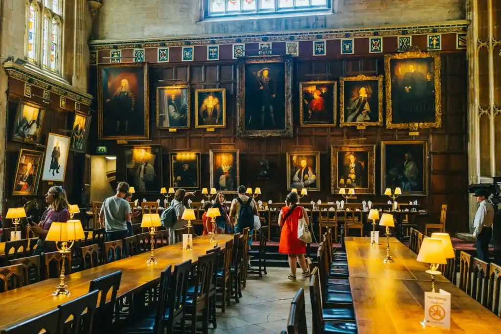 Visitors exploring the Great Hall at Christ Church, Oxford—an iconic Harry Potter filming location in the UK- Harry Potter travel guide