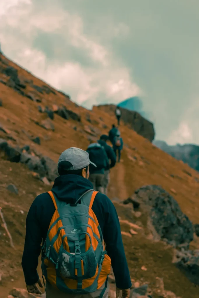 Trekker hiking on a mountain trail with backpack – Kedarnath trek preparation and fitness training