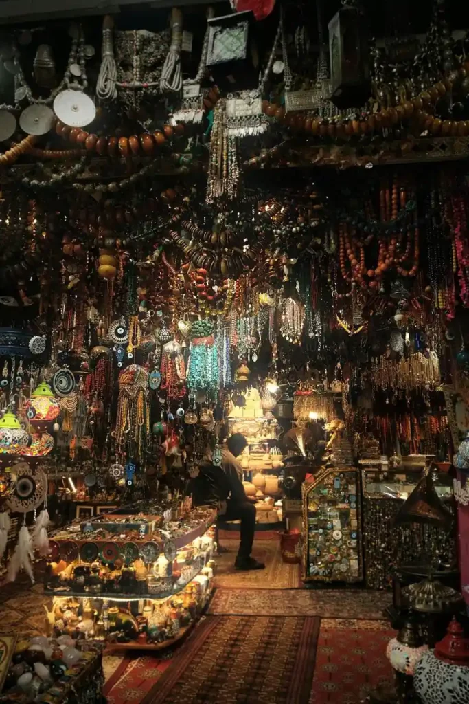 A vibrant traditional market in Oman with colorful lanterns, antique jewelry, and handcrafted souvenirs, perfect for cultural exploration during your Oman travel adventure."